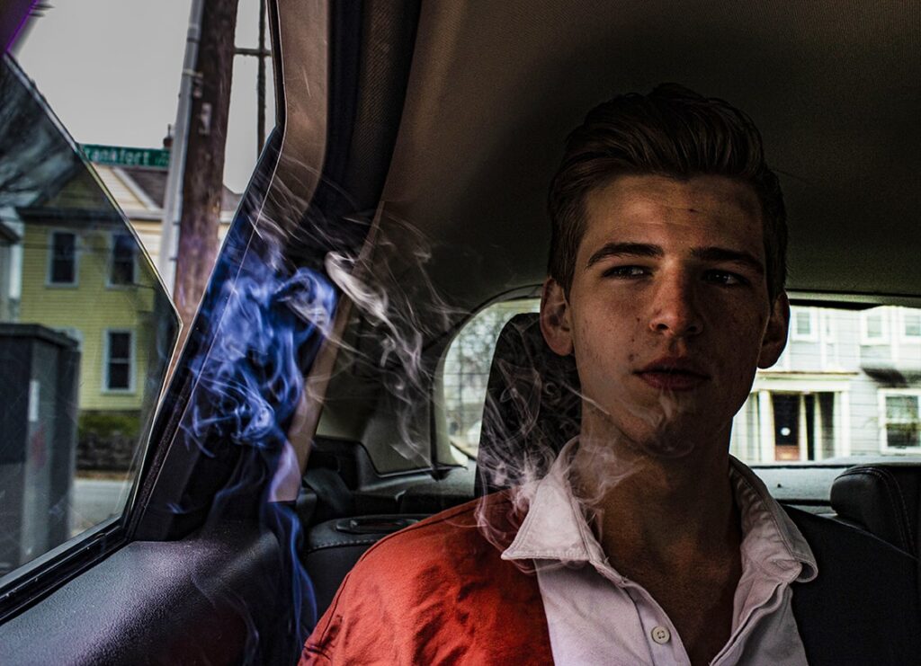 Man smoking in car