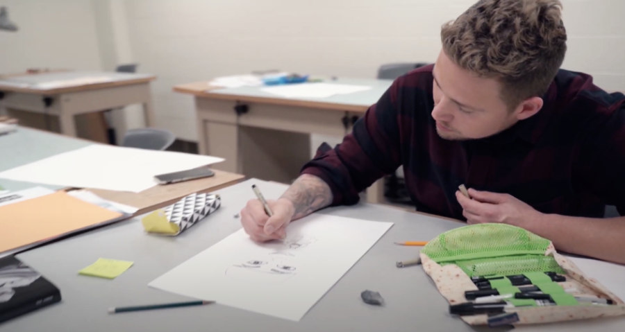 Student drawing in class